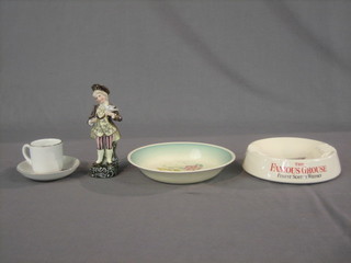 A circular Susie Cooper bowl with floral decoration 8", a Wade Grouse Whisky ashtray 6", a George VI Coronation cup and saucer and a Continental porcelain figure of a boy