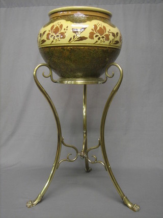 A brown glazed pottery jardiniere raised on a brass stand 13"