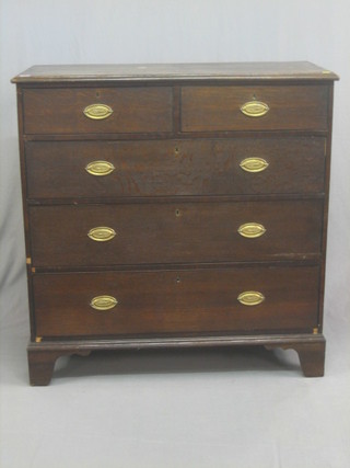 A 19th Century oak chest of 2 short and 3 long drawers with brass drop handles, raised on bracket feet 42"