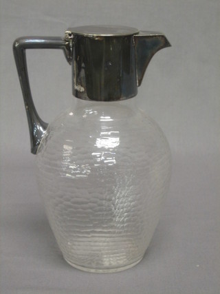A glass claret jug with silver plated mounts by Hukin & Heath