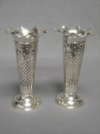 A pair of Edwardian pierced silver specimen vases raised on circular spreading feet 7", 8 ozs