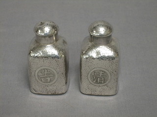 A pair of Eastern silver peppers 2 ozs