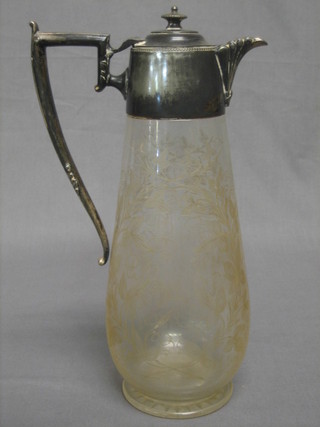 A Victorian etched glass claret jug with silver plated mounts