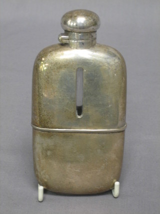 A silver plated hip flask with detachable cup