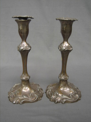 A pair of 19th Century Rococo style silver plated candlesticks 11"