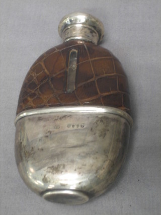 A Victorian oval glass hip flask with detachable cup and silver collar, London 1880