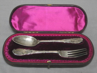 A  Victorian 2 piece engraved Old English pattern christening set, London 1891, cased