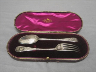 A Victorian 2 piece christening set, London 1877 comprising spoon and fork, cased