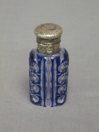 A blue overlay glass scent bottle with silver plated stopper 3 1/2"