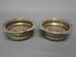 A pair of 19th Century silver plated wine bottle coasters