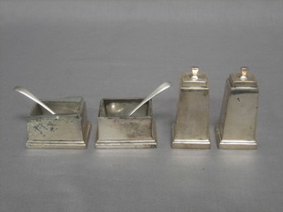 An Art Deco 4 piece rectangular silver cruet, comprising 2 salts, 2 peppers Birmingham 1934