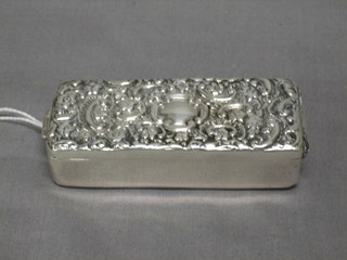 A Victorian rectangular silver tooth pick/collar bone box with embossed decorated hinged lid, the interior with glass liner, Birmingham 1880 3" 