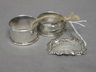 2 silver napkin rings and a silver sherry decanter label