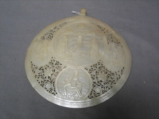 A 19th Century pierced and carved mother of pearl Baptismal shell decorated The Crucifixion 5"