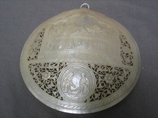 A 19th Century pierced and carved mother of pearl Baptismal shell decorated The Last Supper, marked Lacena Domini 6"