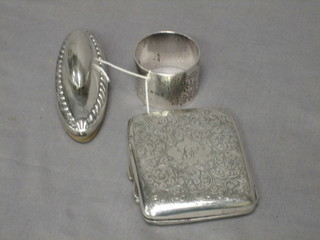 A silver cigarette case with engraved decoration, a silver napkin ring and a silver nail buffer