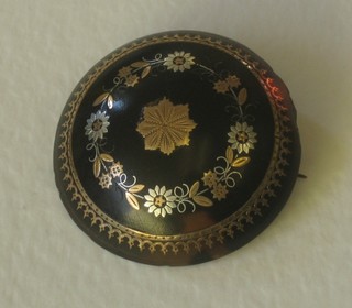 A lady's circular piquet brooch with floral decoration 