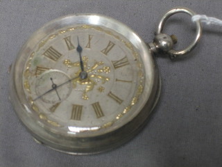 A Continental open faced pocket watch contained in a silver case