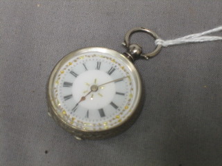 A lady's open faced fob watch with enamelled dial and Roman numerals contained in a silver Continental case