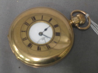 A demi-hunter pocket watch contained in a 9ct gold case (heavily dented)