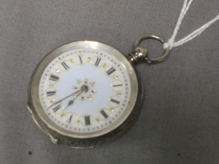 A lady's open faced fob watch contained in a silver case