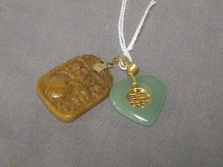 An Eastern hardstone pendant and 1 other