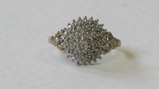 A 9ct gold cluster ring set numerous diamonds
