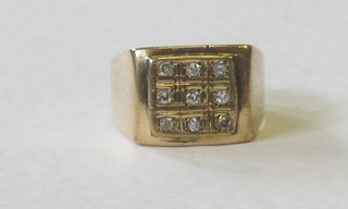 A gentleman's square 9ct gold dress ring set diamonds