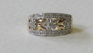 A 9ct pierced gold dress ring set diamonds