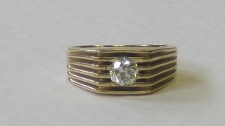 A 14ct gentleman's gold dress ring set a diamond