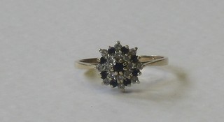A 9ct gold cluster ring set sapphires and diamonds