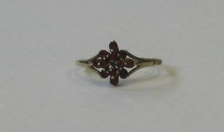 A gold dress ring set red stones