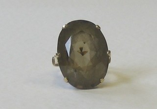 A 9ct gold dress ring an oval cut smoky quartz stone