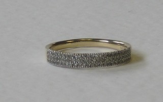 A 9ct gold eternity ring set numerous diamonds
