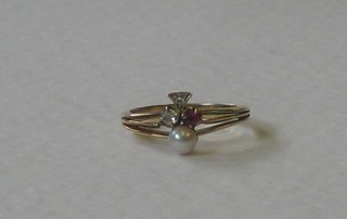 An 18ct gold dress ring set diamonds, ruby and a pearl