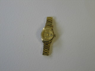 A lady's 18ct gold cased wristwatch with an integral bracelet