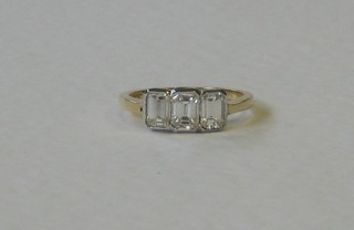 An 18ct yellow gold dress/engagement ring set 3 rectangular cut diamonds, approx 1.30ct