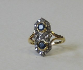 An 18ct yellow gold Victorian style dress ring set 2 sapphires supported by diamonds