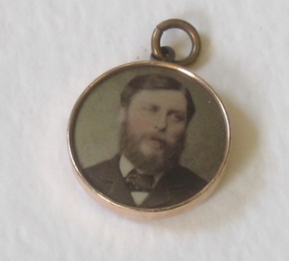 A gilt metal photograph locket
