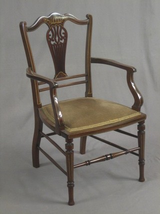 An Edwardian inlaid mahogany open arm carver chair, raised on turned supports
