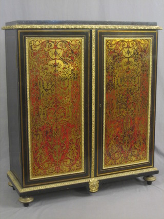 A handsome 19th Century red boulle cabinet with black veined marble top, the interior fitted shelves and enclosed by a red boulle panelled door with gilt metal mounts throughout, raised on bun feet 39"