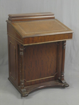 A reproduction Victorian mahogany Davenport with hinged lid, the pedestal fitted 4 long drawers with column supports 24"