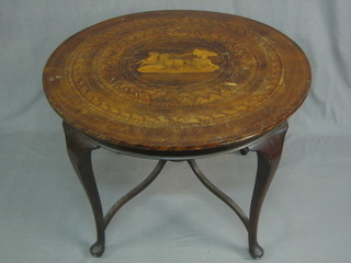A circular inlaid mahogany table with Sorrento style inlaid top decorated a charioteer and raised on cabriole supports 31"