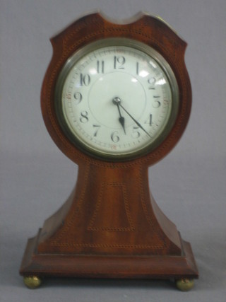 A French bedroom timepiece with silvered dial and Arabic numerals contained in an inlaid mahogany balloon shaped case