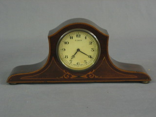 A 1930's 8 day mantel clock with Arabic numerals contained in an Admirals hat inlaid mahogany case