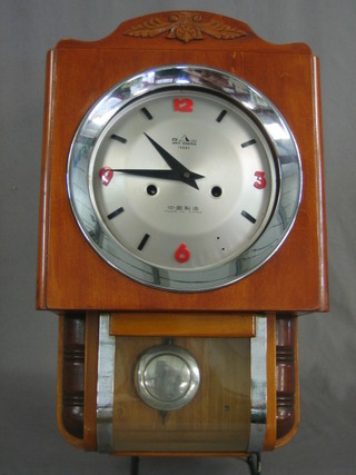 A Chinese wall clock contained in a glazed and wooden case