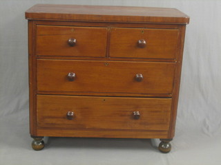 A Victorian mahogany D shaped chest of 2 short and 3 long drawers, raised on bun feet