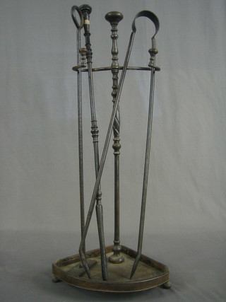 A 19th Century polished steel corner fire implement stand and 3 polished steel fire implements