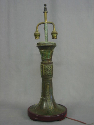 A Eastern bronze table lamp in the form of a trumpet shaped urn 13"