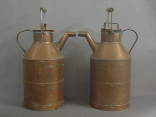 A pair of large copper lidded water carriers